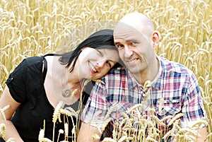 Young couple in a grain field