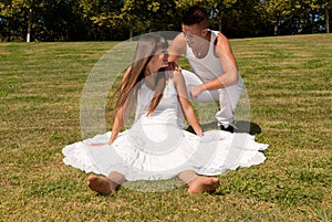Young couple on grass white love relationship