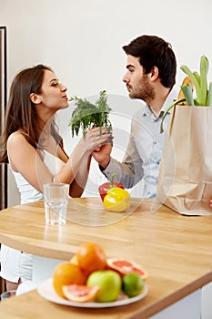 Young Couple with Grossery Bag full of Vegetables. Healthy Lifes