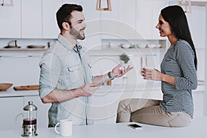 Young Couple Have Breakfast in Modern Kitchen.