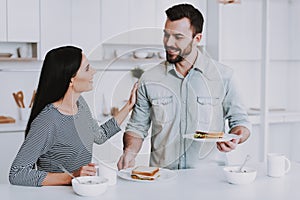 Young Couple Have Breakfast in Modern Kitchen.