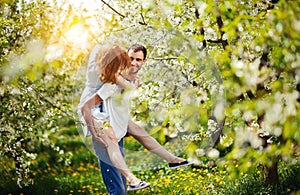 Young couple have fun in the garden