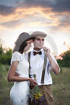 Young Couple Have Got Marriage In Rustic Style In Field