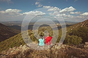 Young couple have a look a beautiful Spanish landscape in a mountain Montseny