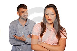 Young couple having an argument with man talking