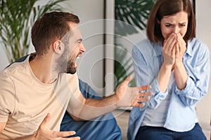 Young couple having arguments at home