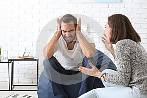 Young couple having arguments at home