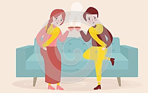 Young couple having a cup of tea or coffee in their living room couch sofa sitting