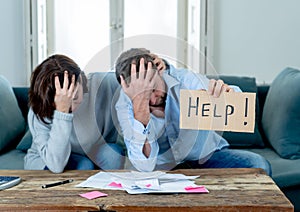 Young Couple having financial problems feeling stressed paying bills debts mortgage asking for help