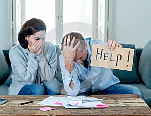Young Couple having financial problems feeling stressed paying bills debts mortgage asking for help