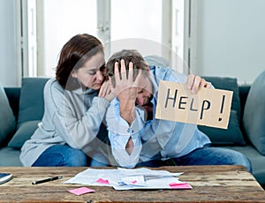 Young Couple having financial problems feeling stressed paying bills debts mortgage asking for help