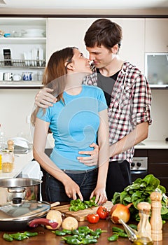 Young couple having flirt at domestic kitchen