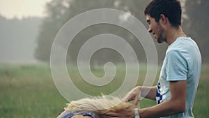 Young couple having fun in the forest