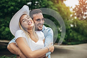 Young couple having fun and laughing together outdoors