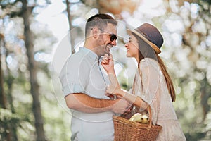 Young couple having fun and laughing together outdoors