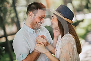 Young couple having fun and laughing together outdoors