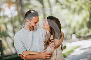 Young couple having fun and laughing together outdoors