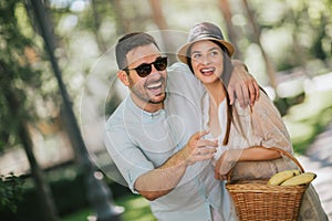 Young couple having fun and laughing together outdoors
