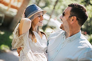 Young couple having fun and laughing together outdoors