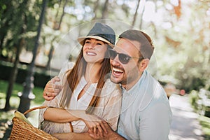 Young couple having fun and laughing together outdoors