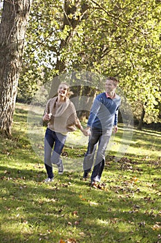 Young couple having fun in park