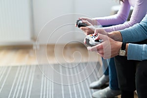 Young couple having fun playing video games