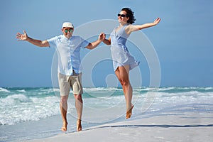 Young couple having fun at tropical beach, Siesta