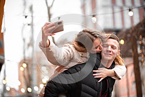 A young couple is having fun on vacation in winter. People love to travel and live together