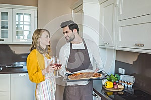 Young couple having a glass of wine