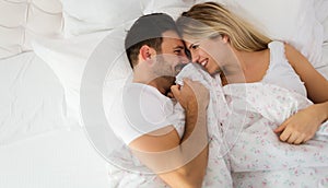 Young couple having having romantic times in bedroom