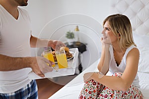 Young couple having having romantic times in bedroom