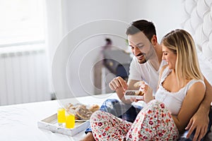 Young couple having having romantic times in bedroom