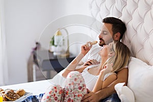 Young couple having having romantic times in bedroom