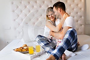 Young couple having having romantic times in bedroom