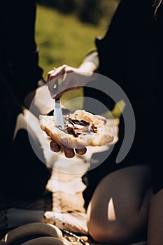 Young couple having lunch in the park on a picnic