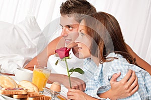 Young couple having luxury hotel breakfast