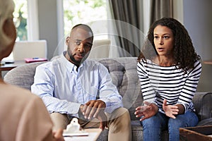 Young couple having marriage counselling photo