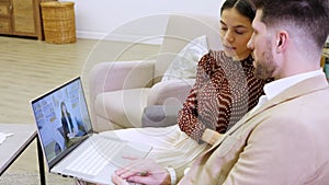 Young couple having online appointment with family psychologist