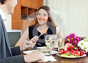 Young couple having romantic dinner with champagne