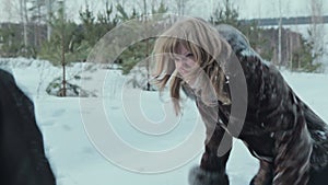 Young couple having snowball fight