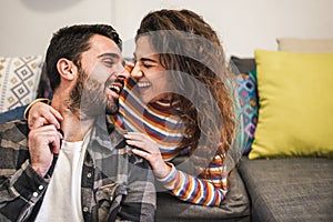 Young couple having tender moments during quarantine isolation - Happy people chilling at home - Domestic lifestyle and