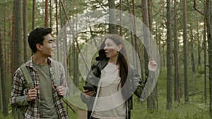 Young couple hiking in a forest