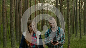 Young couple hiking in a forest