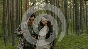 Young couple hiking in a forest