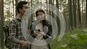 Young couple hiking in a forest