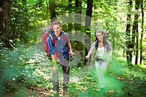 Young couple hiking in a forest