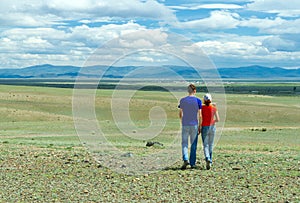 Young couple hiking steppe photo