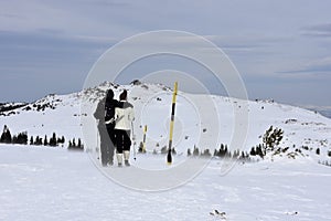 Young couple in mountain, severe winter weather with wind gusts, Vitosha Mountain, Bulgaria
