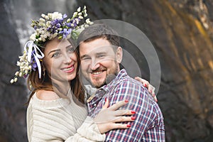 Young couple hipster hugging in nature