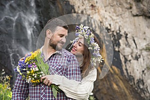 Young couple hipster hugging in nature